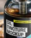 Oil Tincture Dropper Bottle on a Stone Plate with Herbs Mockup