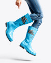 Rain Boots on Jumping Women's Legs with Jeans Mock