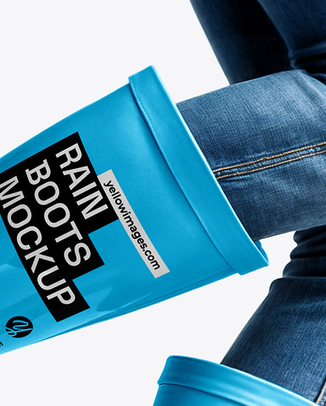 Rain Boots on Jumping Women's Legs with Jeans Mock