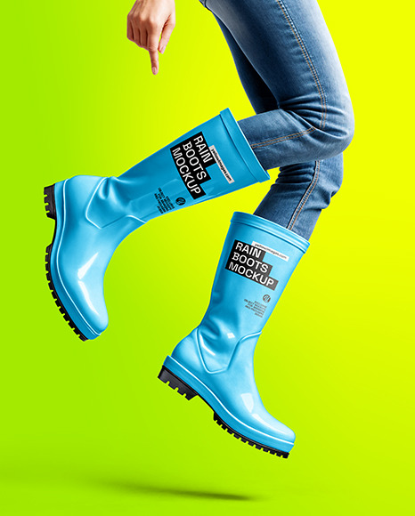 Rain Boots on Jumping Women's Legs with Jeans Mock