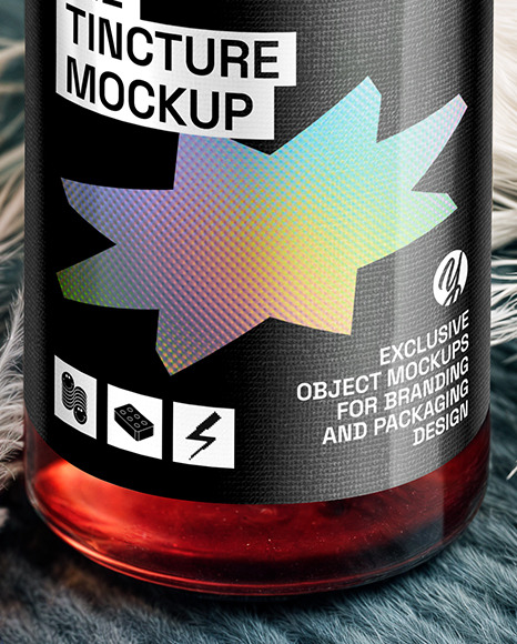 Ruby Oil Tincture Dropper Bottle with Feathers on Fabric Mockup