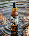 Amber Oil Tincture Dropper Bottle on Water Surface Mockup