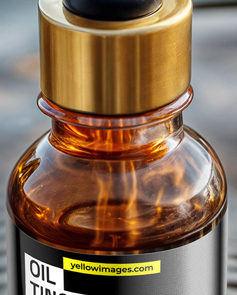 Amber Oil Tincture Dropper Bottle on Water Surface Mockup