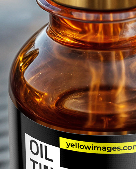 Amber Oil Tincture Dropper Bottle on Water Surface Mockup