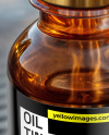 Amber Oil Tincture Dropper Bottle on Water Surface Mockup
