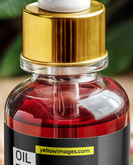 Red Oil Tincture Dropper Bottle with Flowers on Wooden Board Mockup