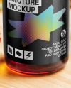 Red Oil Tincture Dropper Bottle with Flowers on Wooden Board Mockup