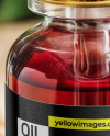 Red Oil Tincture Dropper Bottle with Flowers on Wooden Board Mockup