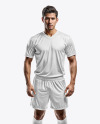 Young Latino Man Wearing V-Neck Soccer Jersey and Shorts Mockup
