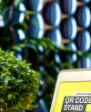 QR Code Scan Stand on a Wooden Table Mockup