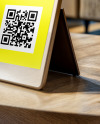 QR Code Scan Stand on a Wooden Table Mockup