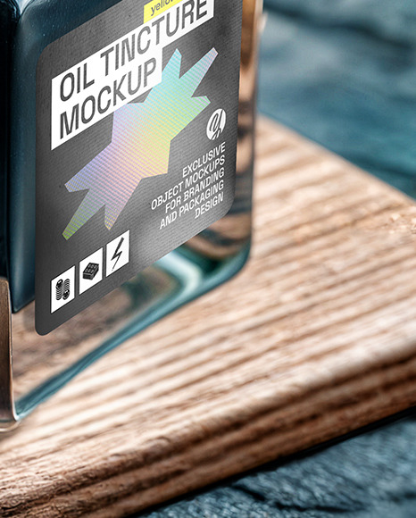 Dark Oil Tincture Square Bottle on a Wooden Board with Herbs Mockup