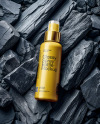 Spray Bottle On Black Stones Mockup