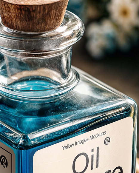 Blue Oil Tincture Square Bottle on a Wooden Board with Dry Flowers Mockup
