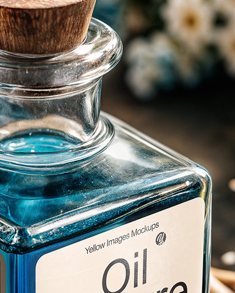 Blue Oil Tincture Square Bottle on a Wooden Board with Dry Flowers Mockup
