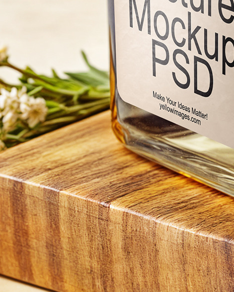 Orange Oil Tincture Square Bottle on a Wooden Board with Herbs Mockup