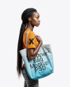 Black Woman with Tote Bag Wearing a T-shirt and Jeans Mockup