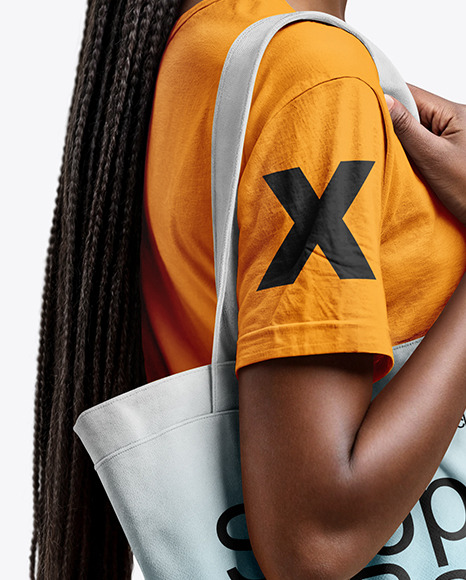 Black Woman with Tote Bag Wearing a T-shirt and Jeans Mockup