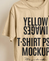 T-Shirt on a Wooden Hanger Against a Plain Background Mockup