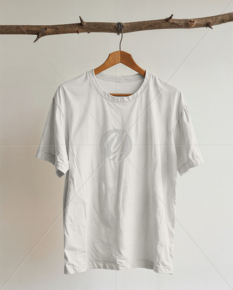 T-Shirt with Wooden Hanger Hanging on a Tree Branch Mockup