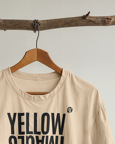 T-Shirt with Wooden Hanger Hanging on a Tree Branch Mockup