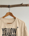 T-Shirt with Wooden Hanger Hanging on a Tree Branch Mockup