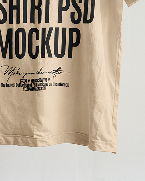 T-Shirt with Wooden Hanger Hanging on a Tree Branch Mockup