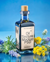 Dark Blue Oil Tincture Square Bottle with Flowers and Blue Backdrop Mockup