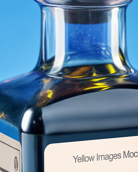 Dark Blue Oil Tincture Square Bottle with Flowers and Blue Backdrop Mockup
