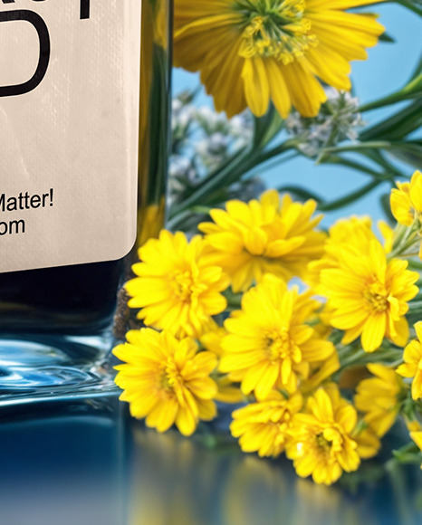 Dark Blue Oil Tincture Square Bottle with Flowers and Blue Backdrop Mockup