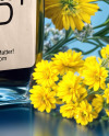 Dark Blue Oil Tincture Square Bottle with Flowers and Blue Backdrop Mockup