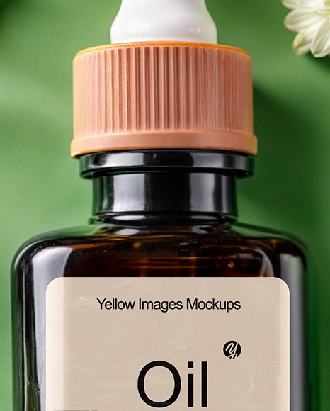 Amber Oil Tincture Square Bottle with Flowers and Green Backdrop Mockup