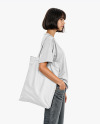 Young Woman with Tote Bag Wearing a T-Shirt and Jeans Mockup