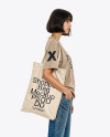 Young Woman with Tote Bag Wearing a T-Shirt and Jeans Mockup