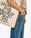 Young Woman with Tote Bag Wearing a T-Shirt and Jeans Mockup