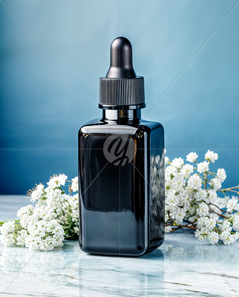Dark Amber Oil Tincture Square Bottle on a Marble Surface with Flowers Mockup
