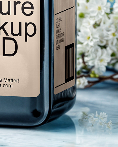 Dark Amber Oil Tincture Square Bottle on a Marble Surface with Flowers Mockup