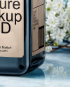 Dark Amber Oil Tincture Square Bottle on a Marble Surface with Flowers Mockup