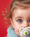 A Baby Girl Wearing Blue Fluffy Fur Coat with Pacifier Mockup