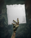 A Zombie Hand Holding a Torn Piece of Paper Mockup