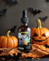 Amber Oil Tincture Dropper Bottle with Halloween Themed Background Mockup
