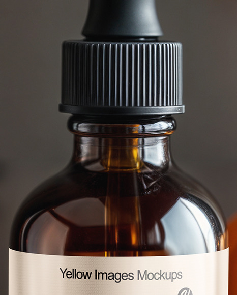 Amber Oil Tincture Dropper Bottle with Halloween Themed Background Mockup