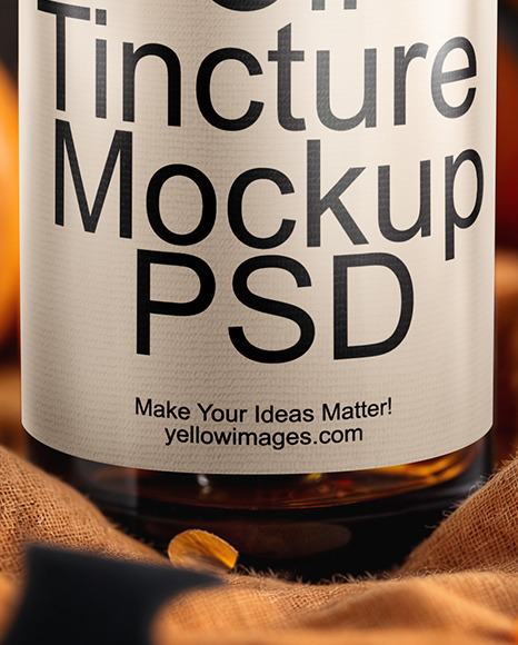 Amber Oil Tincture Dropper Bottle with Halloween Themed Background Mockup