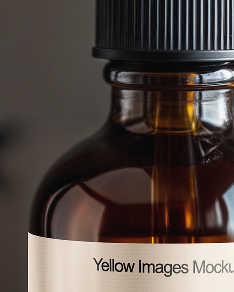 Amber Oil Tincture Dropper Bottle with Halloween Themed Background Mockup