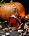 Oil Tincture Square Bottle with Dried Flowers and Pumpkin Mockup