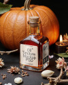 Oil Tincture Square Bottle with Dried Flowers and Pumpkin Mockup