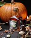 Oil Tincture Square Bottle with Dried Flowers and Pumpkin Mockup