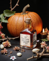 Oil Tincture Square Bottle with Dried Flowers and Pumpkin Mockup