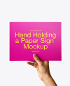Hand Holding a Paper Sign Mockup