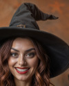 Smiling Halloween Witch Holding a Paper Sign Mockup